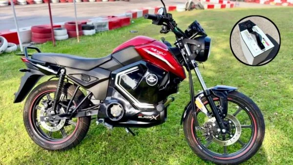 Red Revolt RV BlazeX electric bike on grass with removable battery